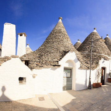 Traditional trulli houses along a small street