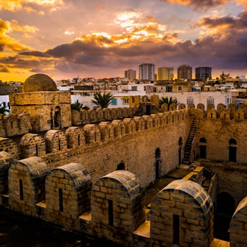View from the walls of the fortress of Ribat of Sousse in Tunisia. Medieval architecture in sunset light.; Shutterstock ID 562040539; Your name (First / Last): Lauren Keith; GL account no.: 65050; Netsuite department name: Online Editorial; Full Product or Project name including edition: Tunisia Destination Page image update