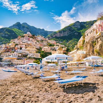 Looking at the beach of the famous village of Positano on the Amalfi coast. Many of the small villages along the Amalfi coastline are hundreds of meters above sea level, because of the geographical reasons. The Amalfi coast is a stretch of coastline on the northern coast of the Salerno Gulf on the Tyrrhenian Sea, located in the Province of Salerno of southern Italy. The Amalfi Coast is a popular tourist destination for the region and Italy as a whole, attracting thousands of tourists annually. In 1997, the Amalfi Coast was listed as a UNESCO World Heritage Site.
1211564544
Positano Beach
