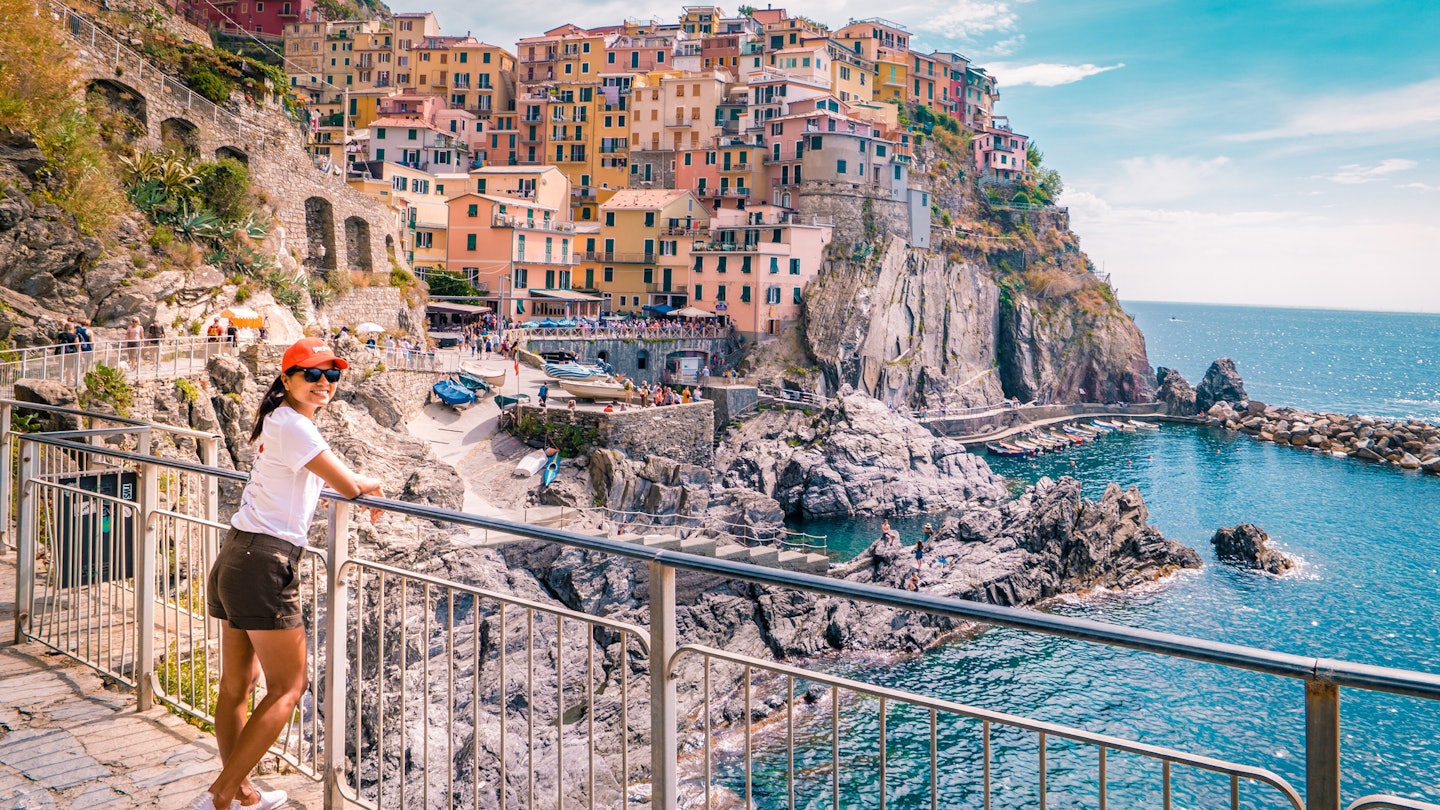 woman visit Manarola Village, Cinque Terre Coast Italy. Manarola is a beautiful small colorful town province of La Spezia, Liguria, north of Italy and one of the five Cinque terre national park Italy
1213749700