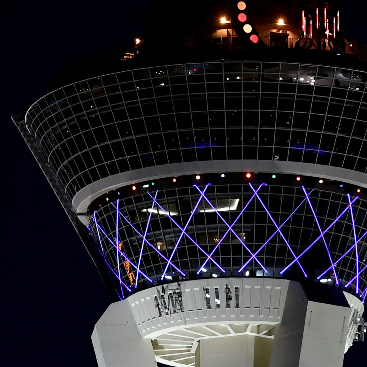LAS VEGAS, NEVADA - DECEMBER 21:  Jupiter (L) and Saturn appear about one-tenth of a degree apart during an astronomical event known as a Great Conjunction to the left of The STRAT Hotel, Casino & SkyPod on December 21, 2020 in Las Vegas, Nevada. The planets, which remain about 450 million miles apart in space, have not appeared this close together from Earth's vantage point since 1623, and it's been nearly 800 years since the alignment occurred at night. The conjunction, which occurs on the night of the winter solstice by coincidence, has become known popularly as the "Christmas Star." The gas giants will not appear this close together again until 2080.  (Photo by Ethan Miller/Getty Images)