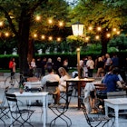643835455
Adult; Adults Only; Chair; Color Image; Dusk; Germany; Glowing; Hedge; Horizontal; Large Group Of People; Leisure Activity; Lifestyles; Lighting Equipment; Men; Munich; Outdoors; People; Photography; Public Park; Real People; Sidewalk Cafe; Tree; Weekend Activities; Women;
People seated on tables outside a Munich cafe in the early evening.