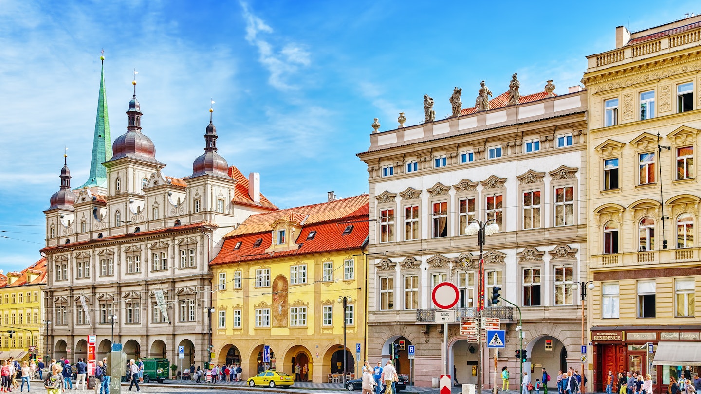 PRAGUE, CZECH REPUBLIC-SEPTEMBER 5, 2015:Main square of Prague's Mala Strana(Lesser Town of Prague).St. Nicholas Church and the adjacent building complex divides the square in an upper and lower part. License Type: media Download Time: 2022-12-01T02:47:17.000Z User: mvm_lonelyplanet Is Editorial: Yes purchase_order:
