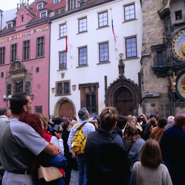 Tourists watching statues of the 12 apostles giving an hourly performance at Orloj (Old Town Hall).