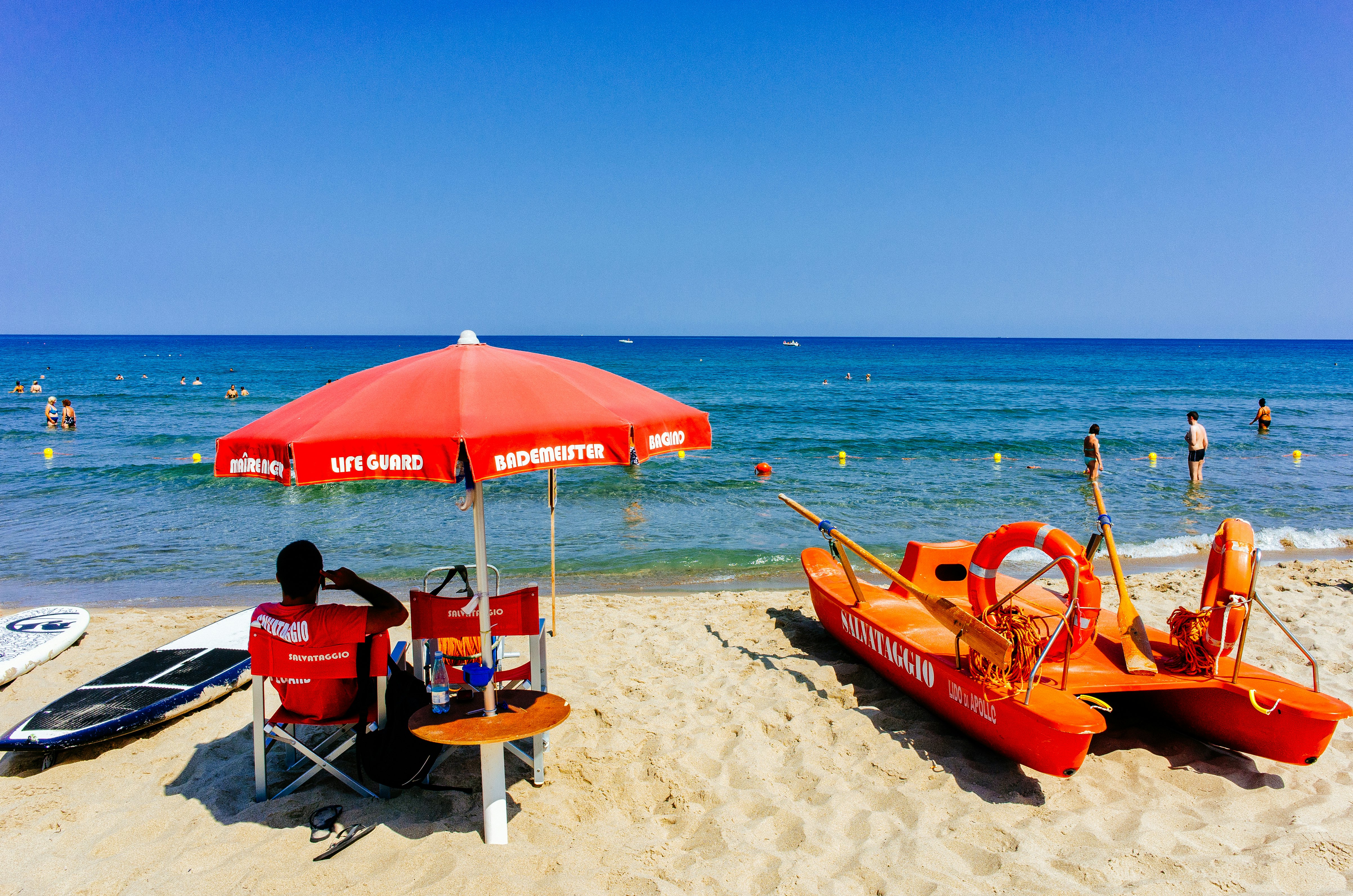 Lifeguard on duty at the beach on July 17, 2013 in Cefalu, Sicily. Cefalu is one of the most popular destinations for a Sicilian vacation.