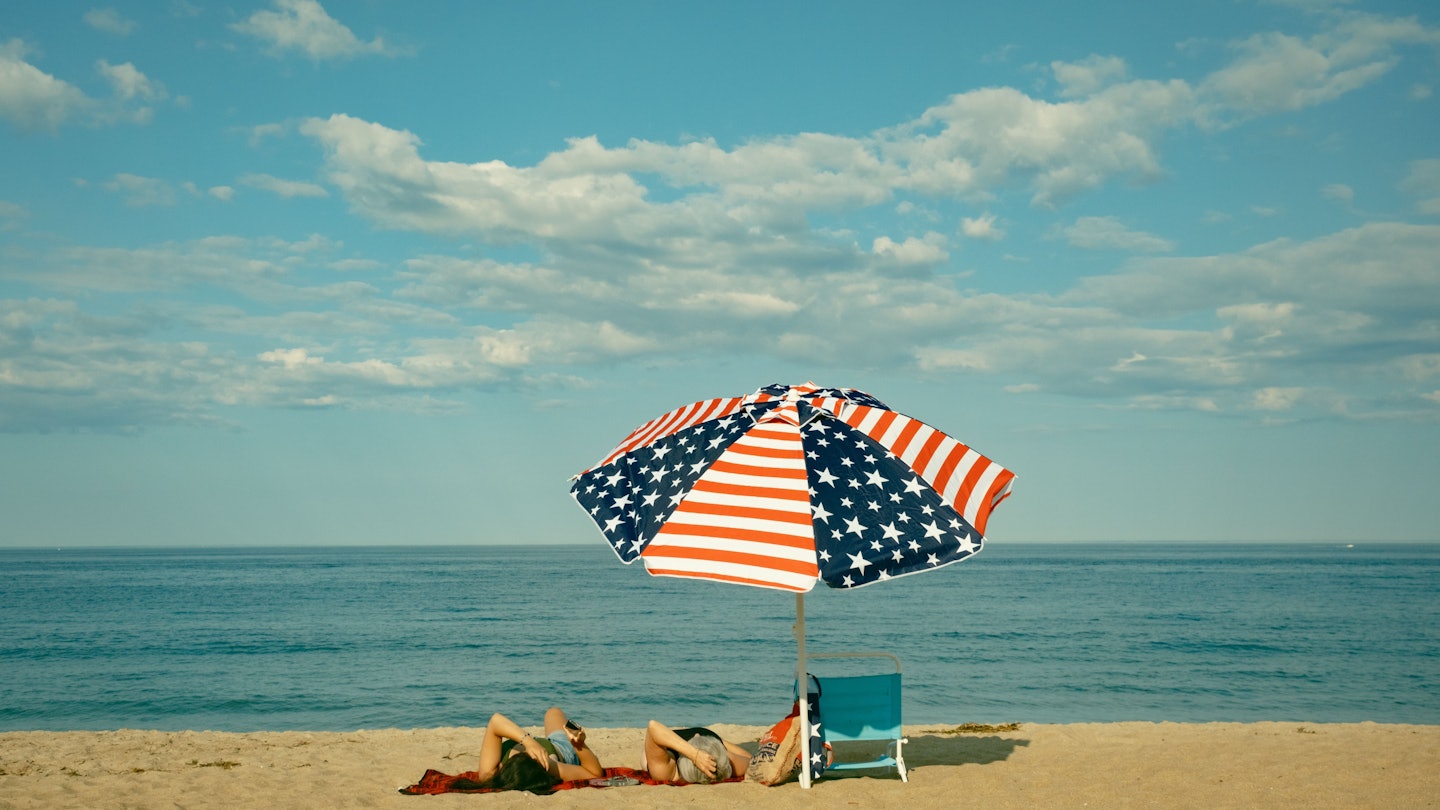 American flag umbrella on the beach, Salisbury Beach, Massachusetts, License Type: media, Download Time: 2025-02-07T15:21:48.000Z, User: Ppeterson948, Editorial: false, purchase_order: 56530 - Guidebooks, job: Global Publishing WIP, client: Global Publishing WIP, other: Pia Peterson Haggarty