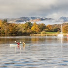 November 12, 2016: Two people paddle a canoe in Windermere lake at Ambleside.
1111423574
ambleside, autumn, boat, bow fell, britain, british, canoe, canoeing, cumbria, england, english, forest, great britain, lake, lake district, lake windermere, landscape, langdale, mist, mountain, national park, nature, recreation, sunny, tree, trees, uk, united kingdom, water, waterhead, windermere, woodland