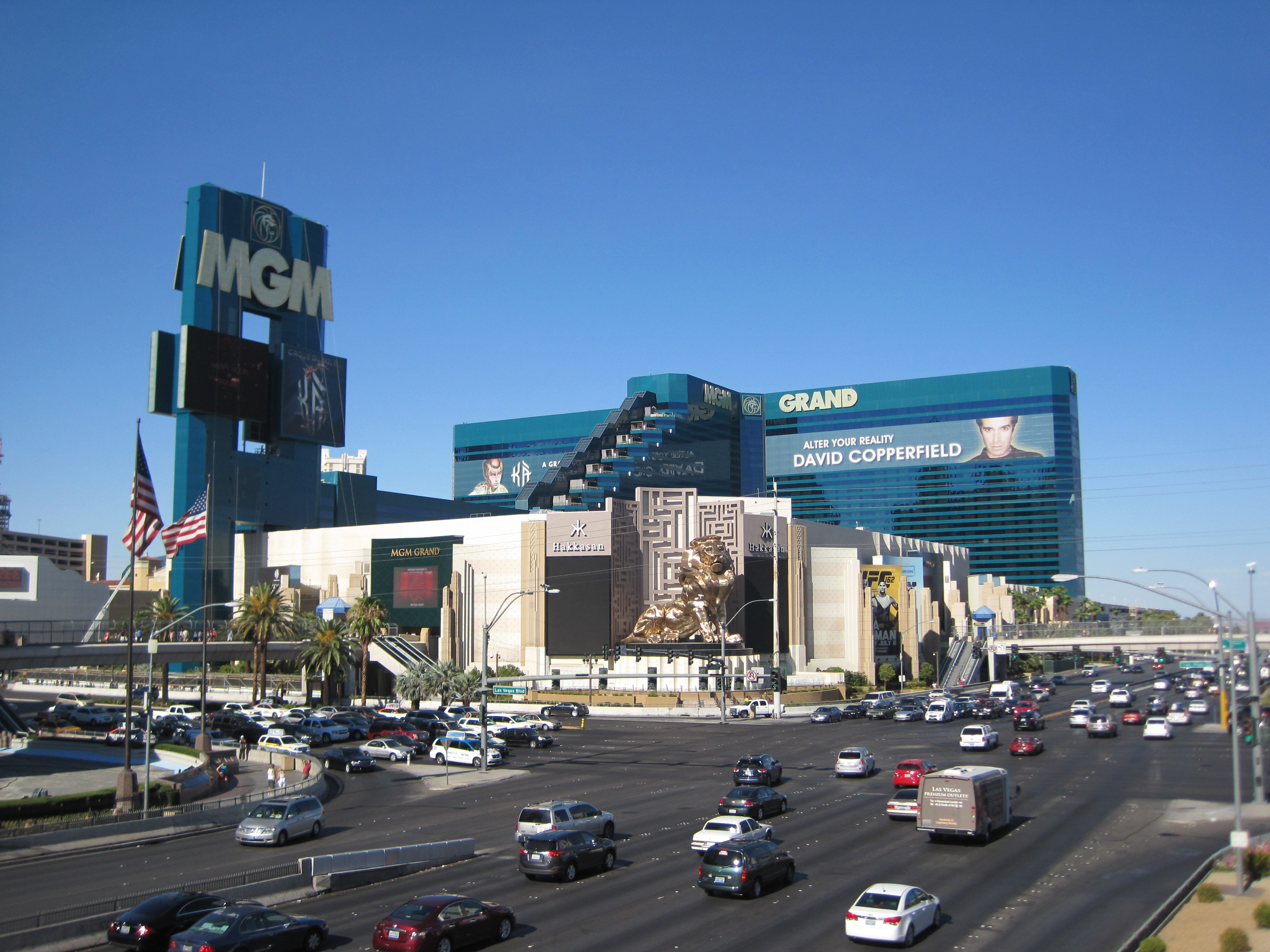 The exterior of The MGM Grand in Las Vegas as seen from across the Strip on a clear, blue, cloudless day.