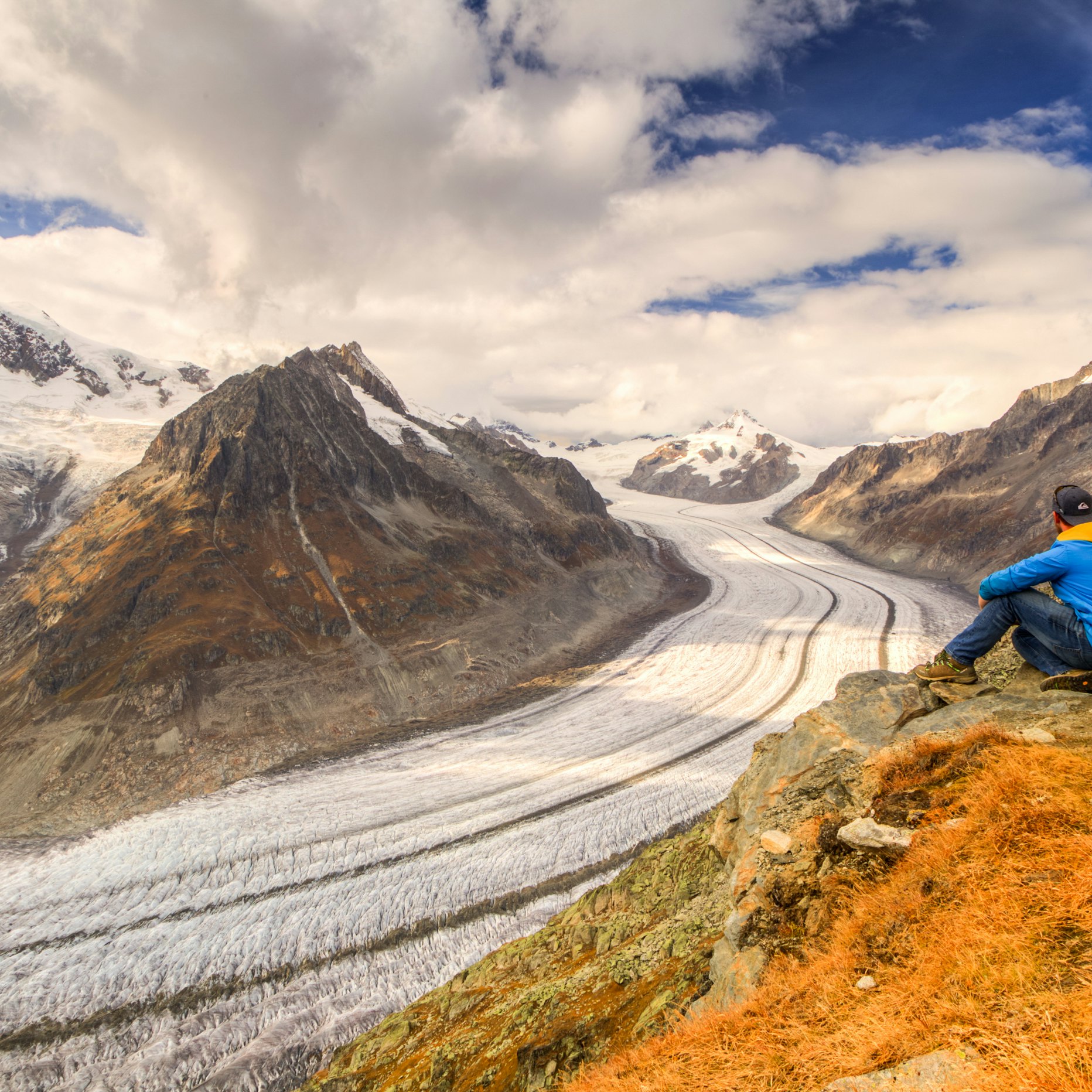 A hiker explores the Aletsch glacier.
